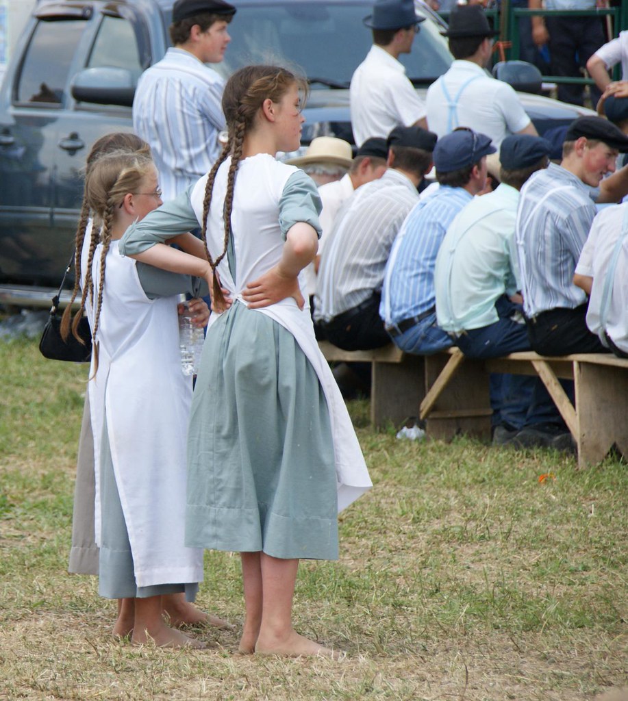 The boys seated on the bench, and standing, are Old Order Mennonites. 