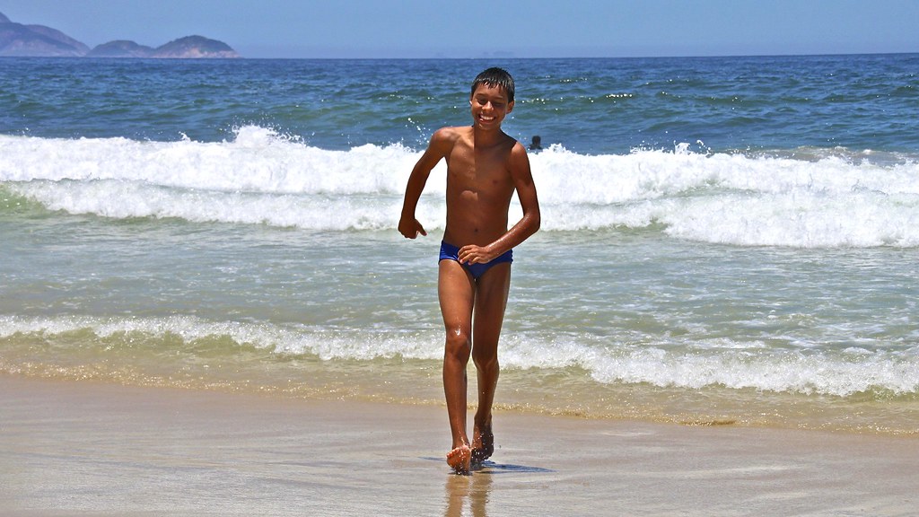 Boy having fun at the Arpoador Beach A Boy having fun at t. 