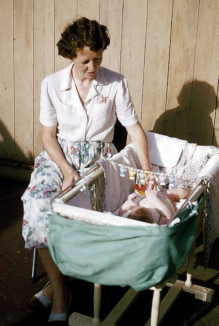 Baby in cot, 1956