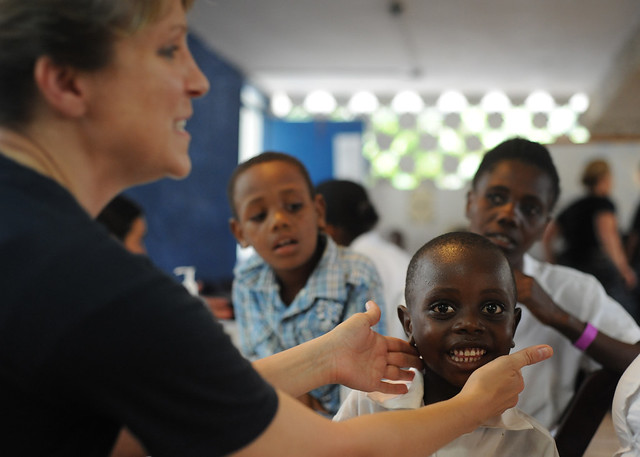 Louisiana native/Sailor examines a patient in Haiti