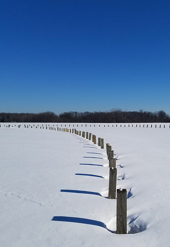 lindstrom minnesota unitedstates snow shadows winter parking lot posts winterscape park