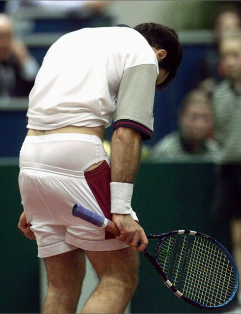 Tennis Player Briefs, Tennis player casually removes his sh…