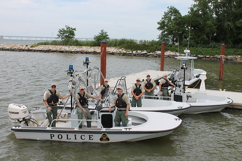 Photo of group of officers in two boats