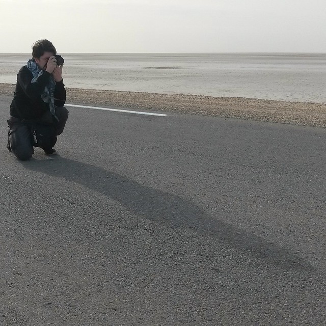Photographer at a void. Salt lake in Tunisia.