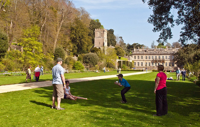 Families relax on the lawns of Dyrham Park, a National Trust property in Gloucestershire