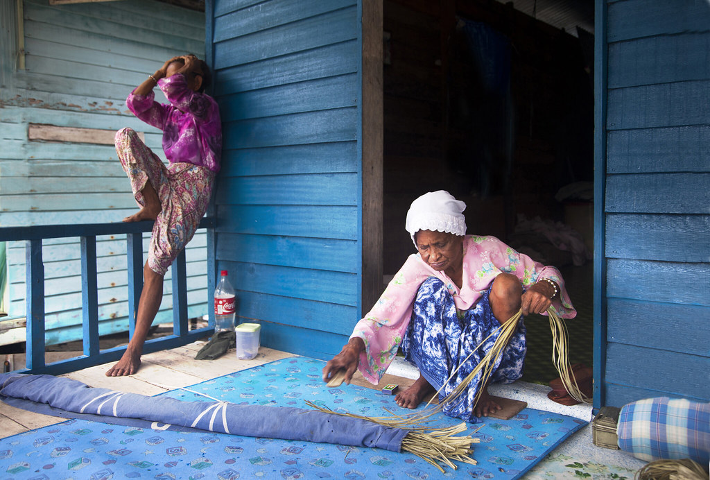 The mat weaver and her camera-shy sister--Sabah , Malaysia