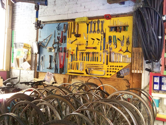 Bloomington, Indiana bike coop: wall of tools, wheel and tube storage