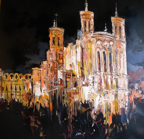 Golden church towers glowing against a black background