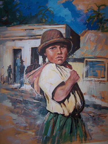 Child standing before white and blue buildings