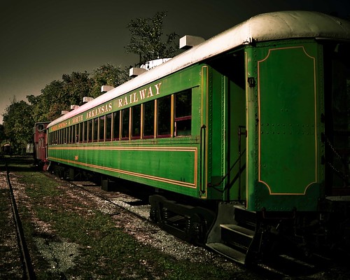 green car train dark landscape caboose passenger