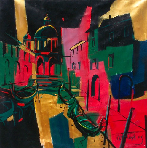 Red and green canal-side buildings with dark water