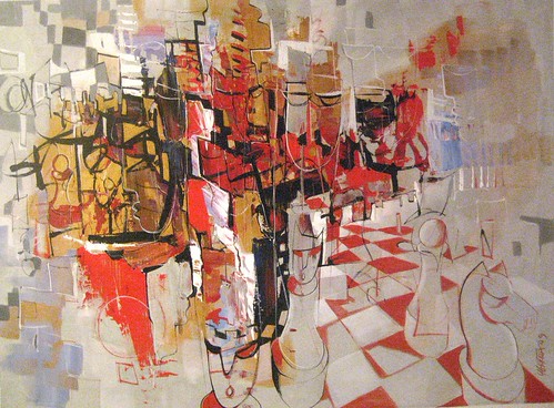 Red and white chess figures on a pale board