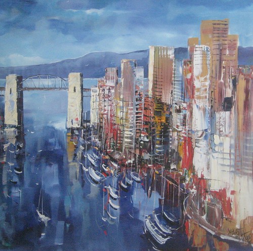City towers and bridge reflected in blue water