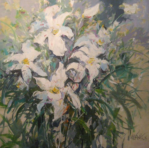 White lilies with long green leaves