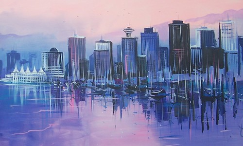 Purple and blue city skyline beside water