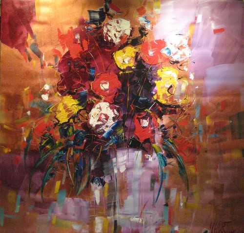 Warm-toned bouquet in a pale vase