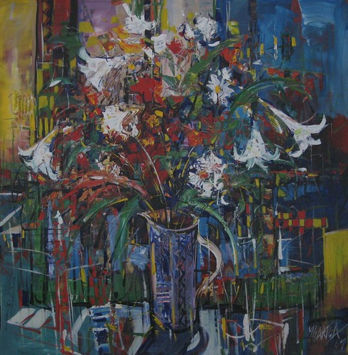White flowers above a tall vase