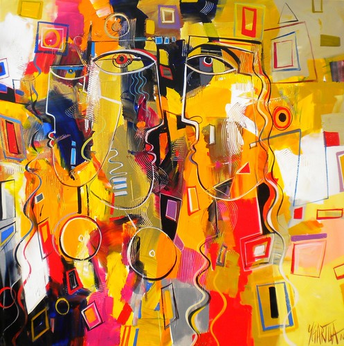 Bright yellow figures among geometric blocks