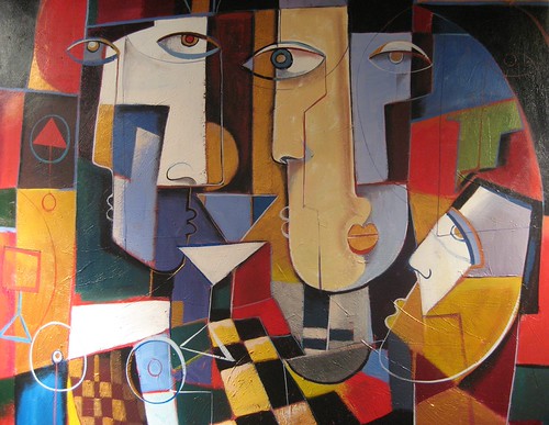 Cluster of geometric faces in red, ochre and blue