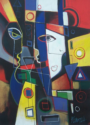 Angular face among green, yellow and blue geometric shapes