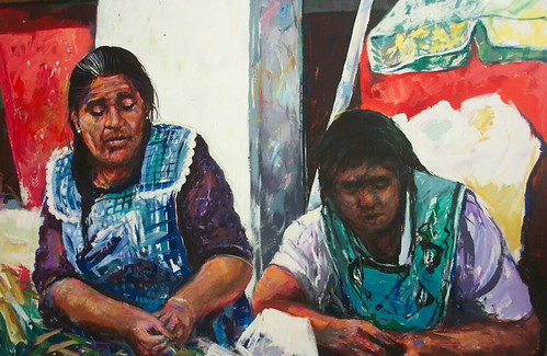 Two seated market figures in green clothing