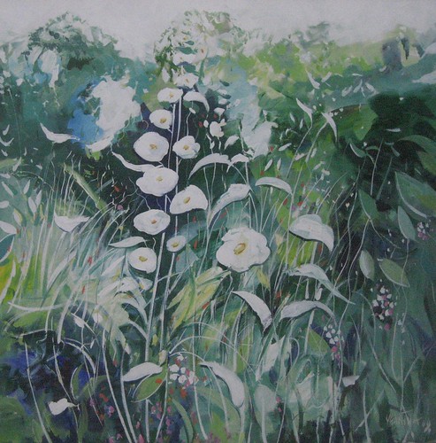 White garden flowers among green leaves