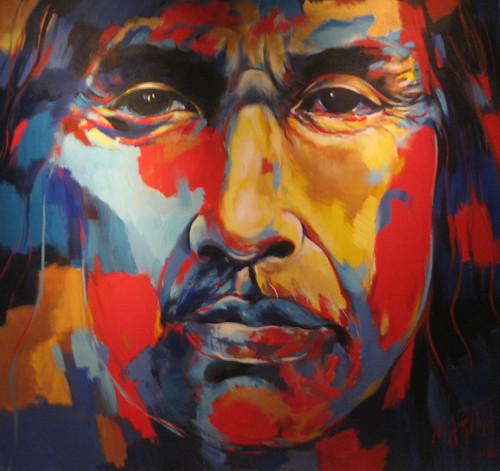Close-up face in blue, orange and red