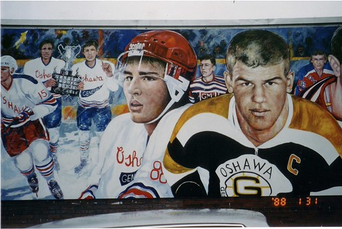 Hockey portraits across a blue wall