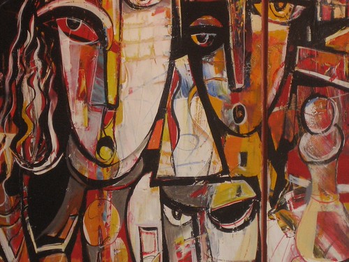 Large angular faces with cream, brown and red blocks