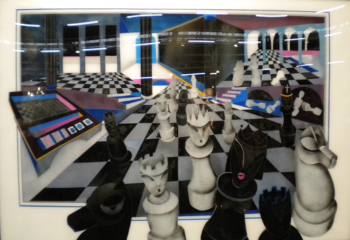 Large chess pieces on a receding chequered board