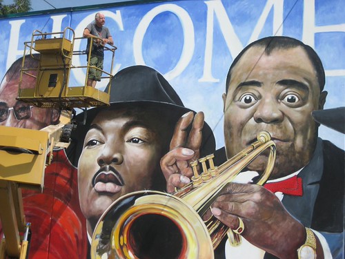 Mural detail of trumpeters and large portraits