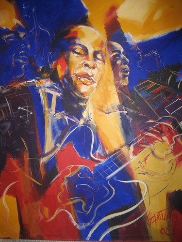 Guitarist portrait surrounded by yellow and blue strokes
