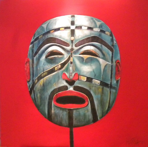 Green and grey mask on a red background