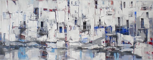 White waterside buildings with blue windows