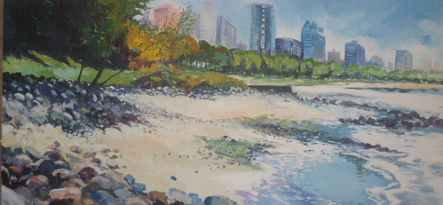 Rocky beach beneath waterfront buildings