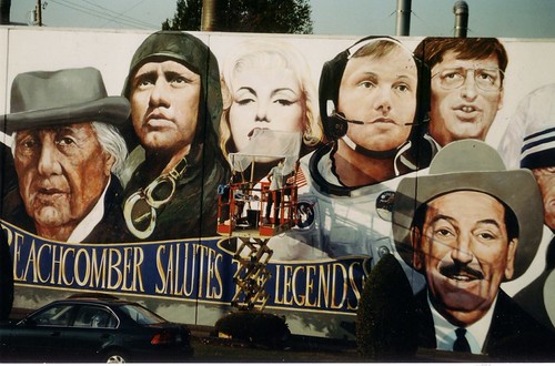 Row of famous faces above mural lettering