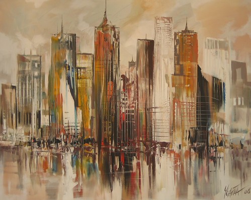 Golden and grey city towers in a muted skyline