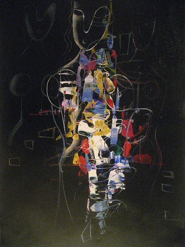Small figure emerging from a dark background