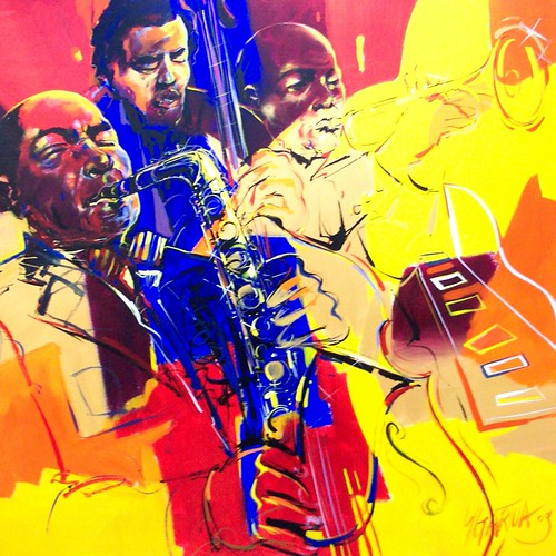 Group of musicians with blue figures on yellow and red