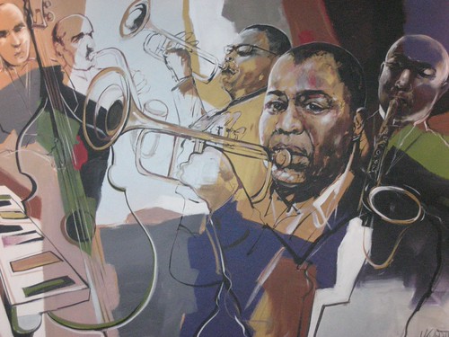 Group of musicians with keyboard and saxophones in muted tones