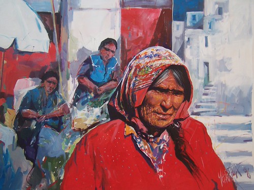 Woman in a red shawl at a market