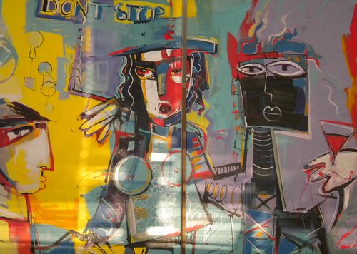 Faces and torsos drawn over yellow and red