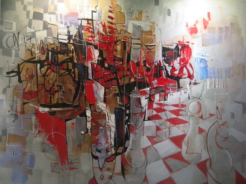 Red and white figures above a receding chessboard