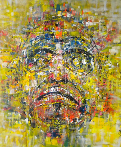 Mask face layered with small marks in yellow and green