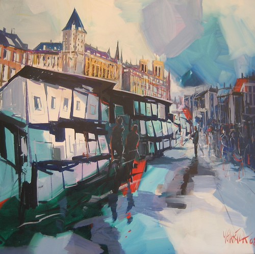 Boats and bridge between canal-side buildings