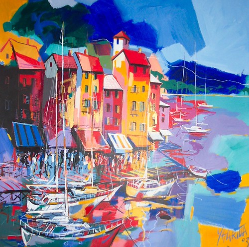 Colourful waterfront houses beside blue water