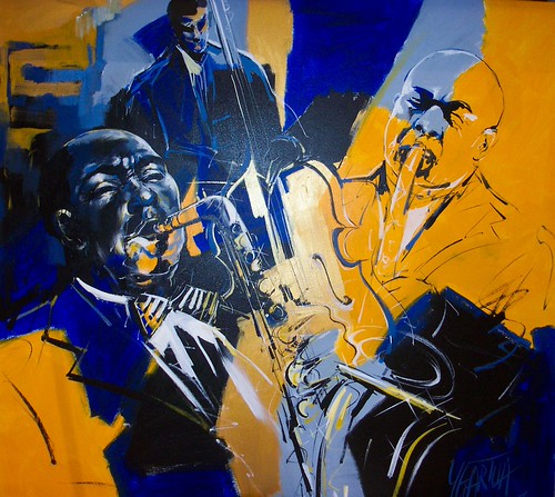 Brass player and musicians on yellow and dark blue
