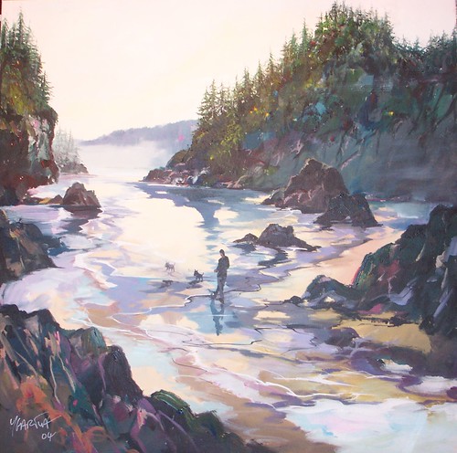 Rocky coastal channel beneath wooded cliffs