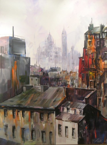 Rooftops receding towards a misty skyline