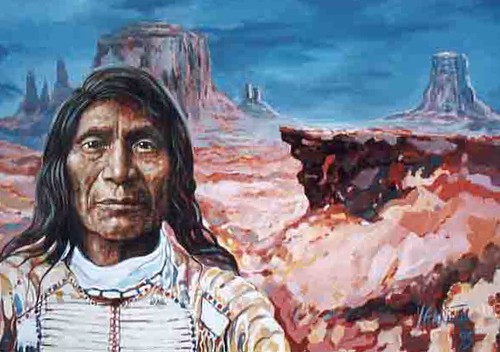 Long-haired man before a red desert landscape